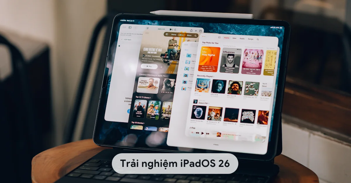 iPad with Apple Pencil and keyboard displaying overlapping apps in iPadOS 26